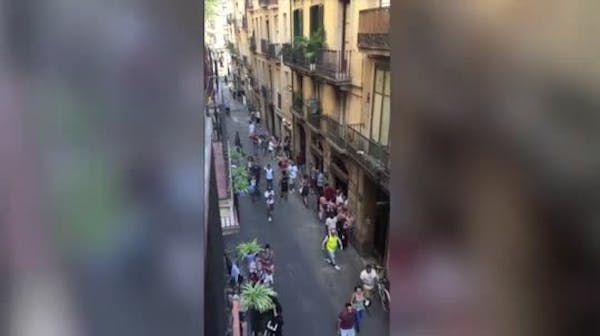 Raw: Barcelona pedestrians flee near van attack