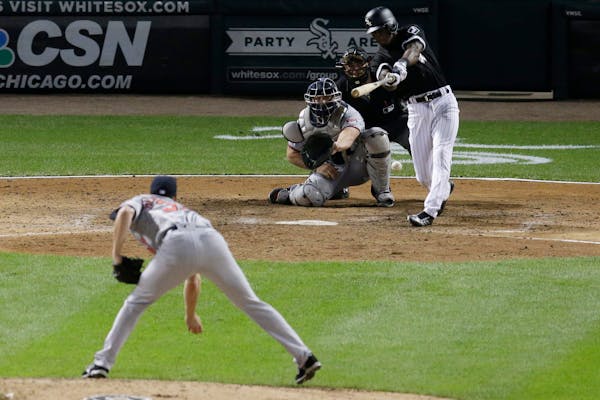 Chicago White Sox's Tim Anderson hits the game-winning single off Minnesota Twins relief pitcher Trevor Hildenberger during the ninth inning of a base