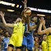 Lynx center Sylvia Fowles (34) comes up with the defensive board next to Seattle Storm's Carolyn Swords (8) and Breanna Stewart (30)