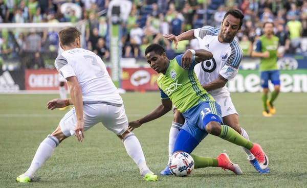 Loons midfielders Jerome Thiesson, left, and Ibson pressured Seattle Sounders defender Joevin Jones during their match Sunday in Seattle.