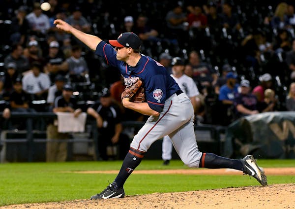 Minnesota Twins relief pitcher Matt Belisle delivers against the Chicago White Sox during the ninth inning of a baseball game in Chicago on Tuesday, A
