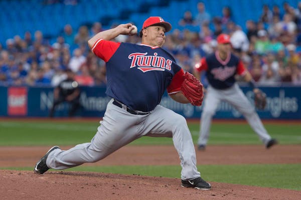 Minnesota Twins starting pitcher Bartolo Colon works against the Toronto Blue Jays during the first inning of a baseball game Friday, Aug. 25, 2017, i