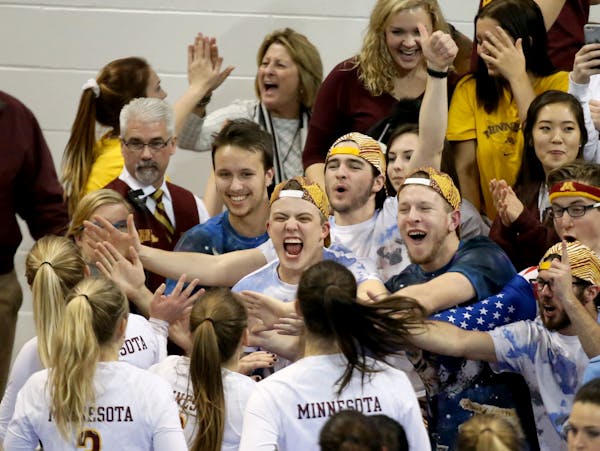 Gophers fans celebrate a victory over Missouri during the regional NCAA volleyball tournament last December.