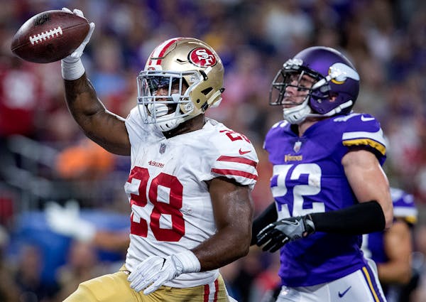 49ers running back Carlos Hyde ran in for a touchdown in the second quarter Sunday against the Vikings, which got Harrison Smith and Mike Zimmer talki