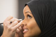 Halima Aden has her makeup done for the Miss Minnesota USA pageant last year.