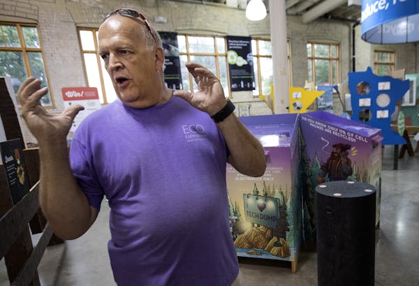 Wayne Gjerde spoke about the dock pilings made of recycled materials that are on display in the Eco-Experience building at the Minnesota State Fair. ]