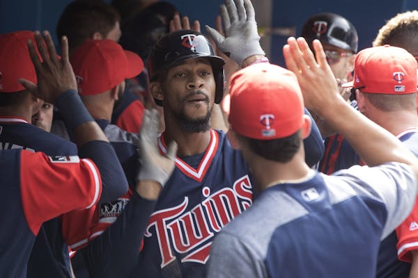 Twins center fielder Byron Buxton celebrated in the dugout after hitting a a two-run homer off Toronto’s Joe Biagini during the fourth inning. Buxto