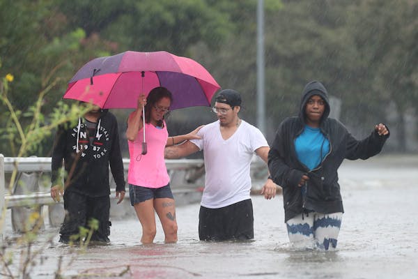 Floodwaters overwhelm Houston rescue efforts