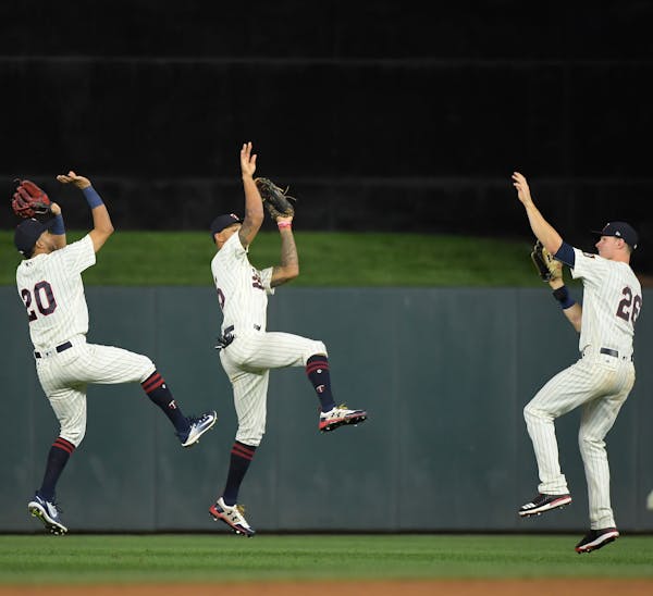 From left, Eddie Rosario, Byron Buxton and Max Kepler showed their three-point shooting form after the Twins beat Arizona Aug. 19. “Mine never goes,
