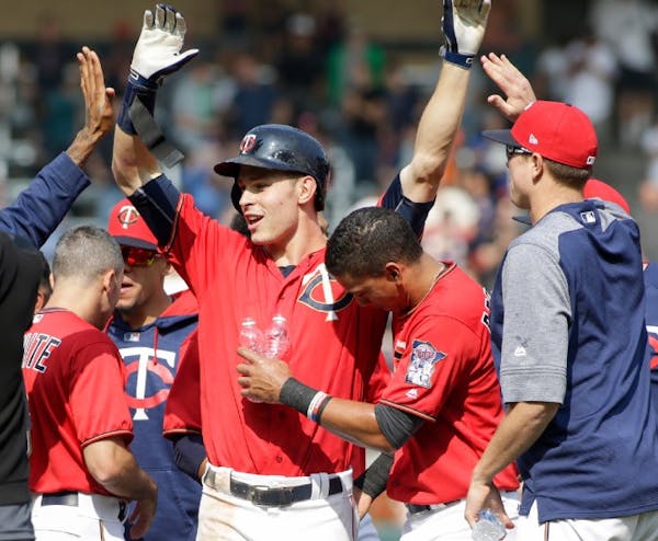 Max Kepler and his teammates celebrated after he was hit by a pitch in the bottom of the ninth inning to give the Twins a 5-4 victory over the White S