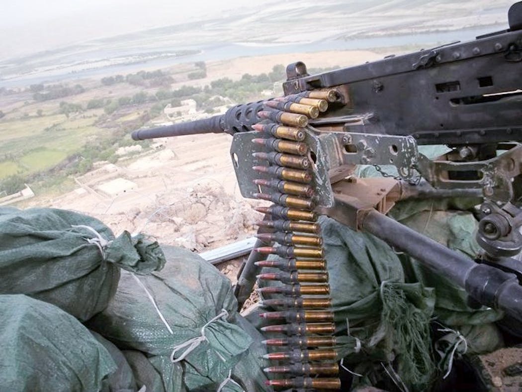 The 50-caliber machine gun in the outpost facing Tree Line Black in Afghanistan. Levi Minissale and another Marine were ordered to fire on a group of Afghans. The Marines found out later that the group included civilian farmers and children.