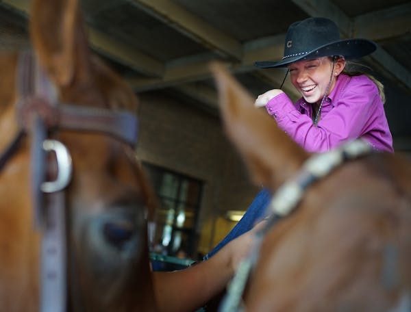 Saddled up: Michelle Sparks, 26, and her quarter horse Lucky took a break between events at the State Fair horse show on Sunday.