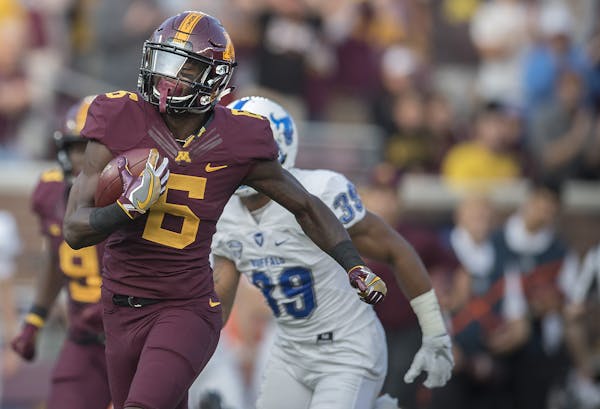 Gophers receiver Tyler Johnson took off for a 61-yard touchdown reception in Thursday’s first quarter against Buffalo. Photo by ELIZABETH FLORES, li