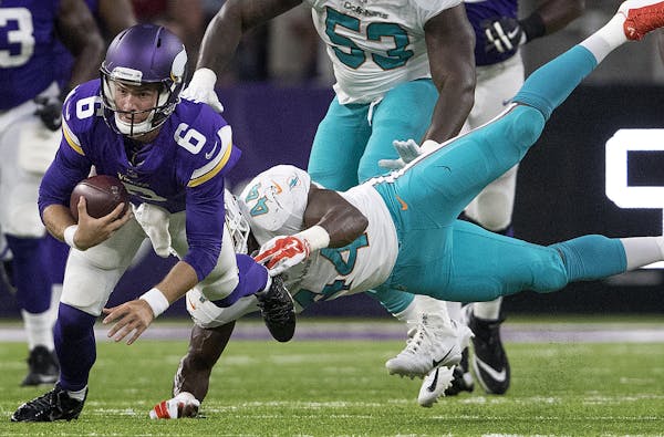 Taylor Heinicke was tackled by Deon Lacey (44) in the first quarter Thursday. Heinicke later suffered a concussion. ] CARLOS GONZALEZ ï cgonzalez@sta