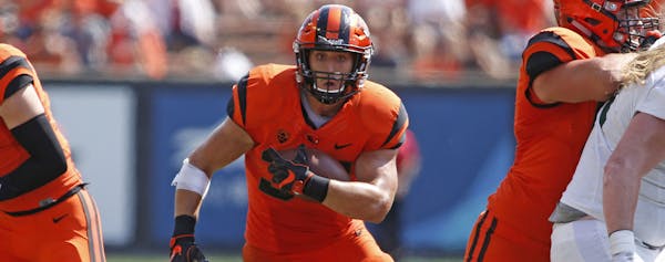 Oregon State running back Ryan Nall, center, during an NCAA college football game, in Corvallis, Ore., Saturday, Sept. 2, 2017. (AP Photo/Timothy J. G