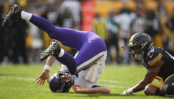Minnesota Vikings quarterback Case Keenum rolled over after throwing an incomplete pass while being hit by Pittsburgh Steelers inside linebacker Vince