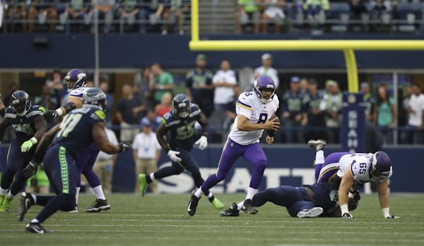 Vikings quarterback Sam Bradford (8) scrambled for a four yard gain in the first quarter last week in Seattle.