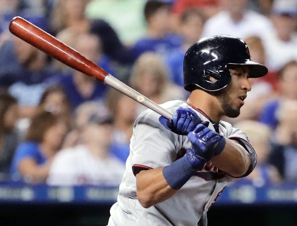 Minnesota Twins' Eddie Rosario watches his two-run single during the fourth inning of a baseball game against the Kansas City Royals on Friday, Sept. 