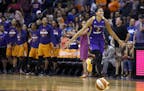 Los Angeles Sparks' Candace Parker, right, celebrates as time expires during the second half of Game 3 of a WNBA basketball playoff semifinal against 