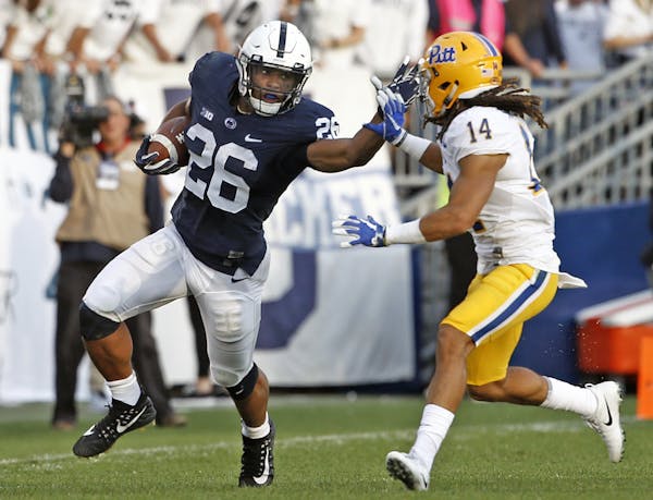 Will Saquon Barkley and Big Ten favorite Penn State survive a visit to Iowa City? Tune in Saturday night to find out. (AP photo by Chris Knight)