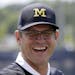 Will Jim Harbaugh be smiling in Ann Arbor, Mich., on Nov. 4? (Associated Press photo by Carlos Osorio).