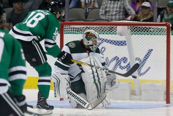 Dallas Stars right wing Tyler Pitlick (18) scores a goal against Minnesota Wild goalie Alex Stalock during the first period of a preseason NHL hockey 