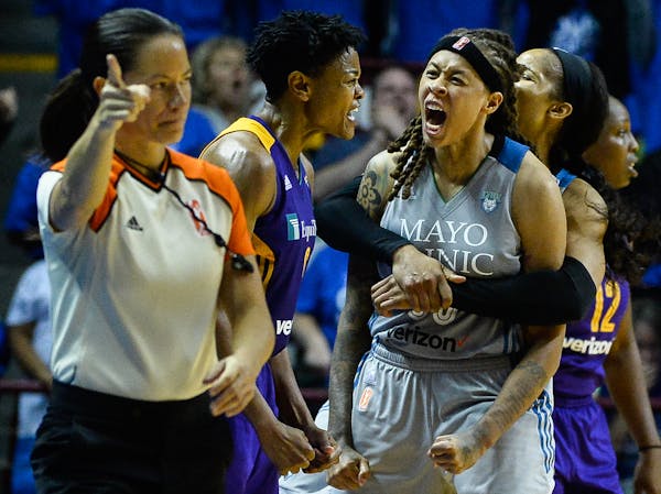 Maya Moore hugged Lynx teammate Seimone Augustus after they helped force a five-second violation on an inbounds play late in the fourth quarter.