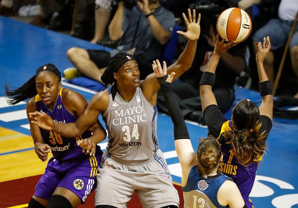 Minnesota Lynx center Sylvia Fowles (34) tried to block Los Angeles Sparks guard Odyssey Sims's (1) shot as she blocked Los Angeles Sparks forward Nne