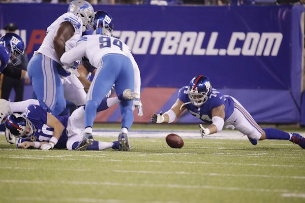 New York Giants offensive tackle Ereck Flowers (74) dives on the ball after quarterback Eli Manning (10) was hit during the first half.