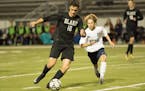 Blake senior Ethan Roe dribbled upfield against Orono on Thursday night. Roe scored the Bears' second goal in their 3-2 victory over the Spartans.