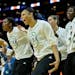 The Minnesota Lynx bench, including forward Plenette Pierson, center, celebrated a 3-point basket by guard Renee Montgomery in the first quarter of Ga