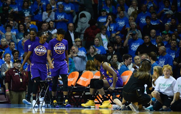 The Los Angeles Sparks emerged from the locker room after leaving the court for the National Anthem Tuesday night.