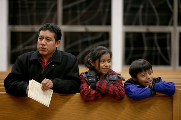 Jacobo Gabriel-Tomas attended a mass with his children in Worthington in 2014. On Tuesday, he crossed the border from Mexico back to Guatemala, leavin