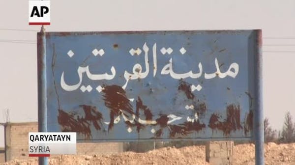 Raw: Dozens found dead in Syrian town