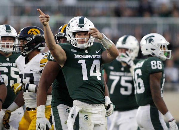 Quarterback Brian Lewerke and the Spartans could hand the Gophers their third consecutive loss Saturday night. (AP photo by Al Goldis)