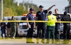 Law enforcement officials work the scene of a fatal shooting at the First Baptist Church in Sutherland Springs, Texas, on Sunday, Nov. 5, 2017. (Nick 
