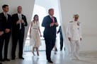 U.S. President Donald Trump and first lady Melania Trump, accompanied by Command Commander Adm. Harry Harris, right, participate in a wreath laying ce