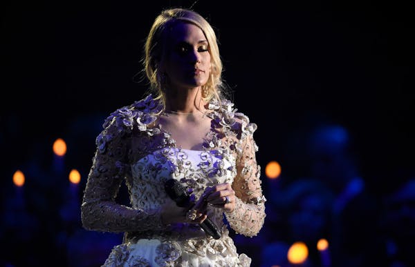 Carrie Underwood rules stage and carpet at CMAs