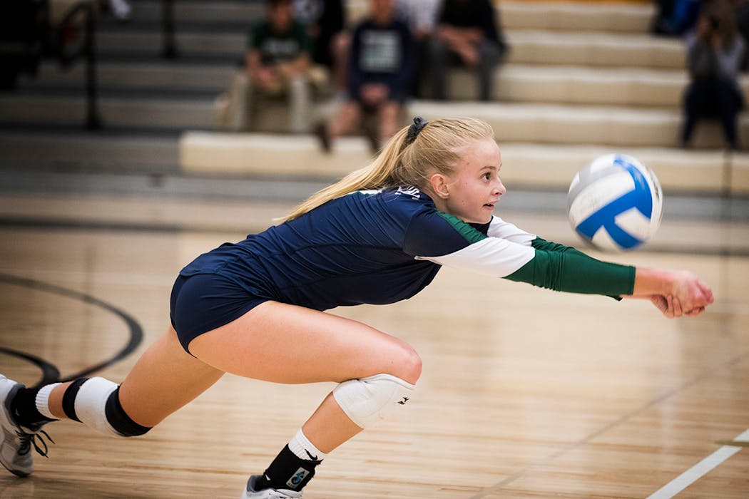 Grutzmacher goes for a dig during a game with her Rosemount High School team.