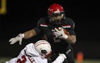 Eden Prairie's Solo Falaniko broke a tackle by by Lakeville North's Nick Gregg while running in the fourth quarter.