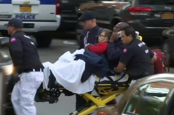 In this still image taken from video, emergency personnel respond to victims after a motorist drove onto a busy bicycle path near the World Trade Cent