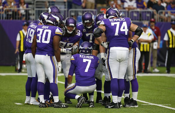 Minnesota Vikings quarterback Case Keenum called the play in the huddle during the second half of against the Tampa Bay Buccaneers on Sunday in Minnea