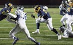 Prior Lake running back Jordan Johnson bounces to the outside for his second touchdown run of the first half Friday night against Blaine.