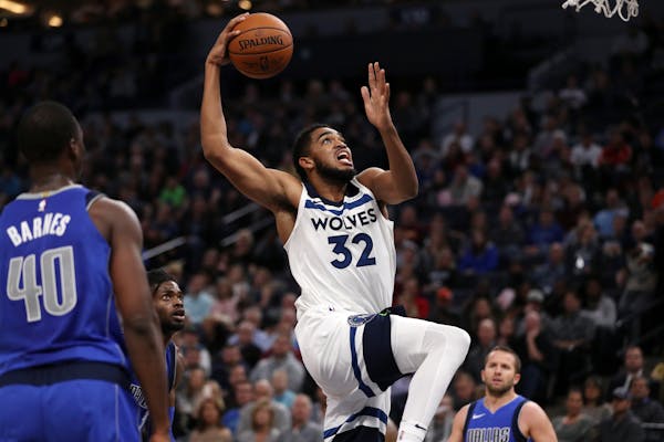 Wolves center Karl-Anthony Towns dunked in the first half against the Mavericks on Saturday night, on his way to scoring 31 points.