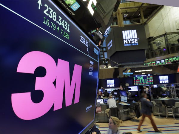 The logo for 3M appears on a screen above the trading floor of the New York Stock Exchange, Tuesday, Oct. 24, 2017. Caterpillar and Post-it note maker
