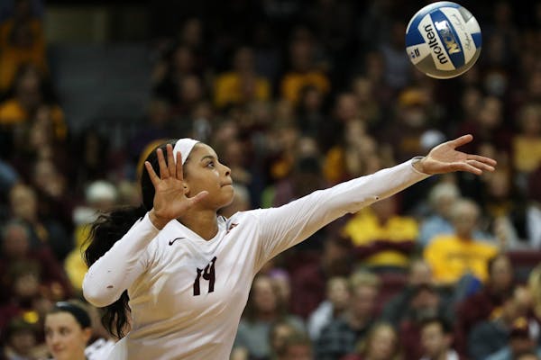 Minnesota outside hitter Alexis Hart (19) served the ball in the third set.