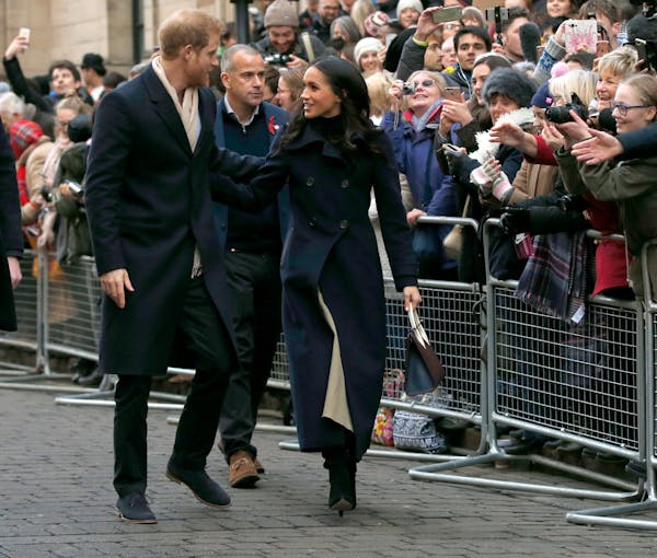 Britain's Prince Harry and his fiancee Meghan Markle arrive at the Terrence Higgins Trust World AIDS Day charity fair, in Nottingham, England, Friday,