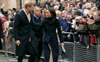 Britain's Prince Harry and his fiancee Meghan Markle arrive at the Terrence Higgins Trust World AIDS Day charity fair, in Nottingham, England, Friday,