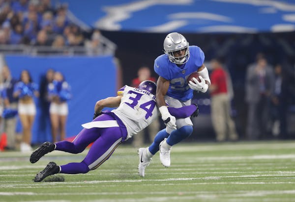 Minnesota Vikings strong safety Andrew Sendejo (34) tackles Detroit Lions running back Theo Riddick (25) during an NFL football game in Detroit, Thurs