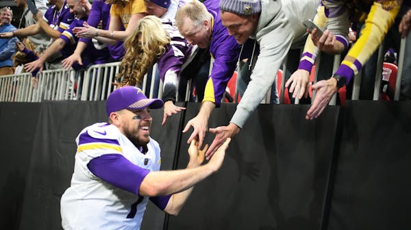 Vikings quarterback Case Keenum celebrated with fans after beating the Falcons 14-9 at Mercedes-Benz Stadium